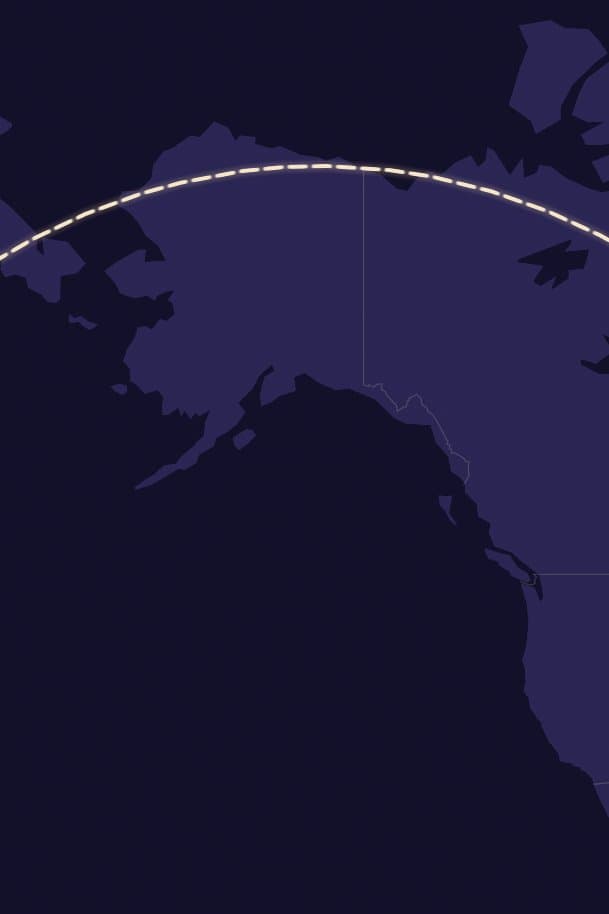 A dashed flight route arching over Alaska and the Bering Sea on a dark world map.