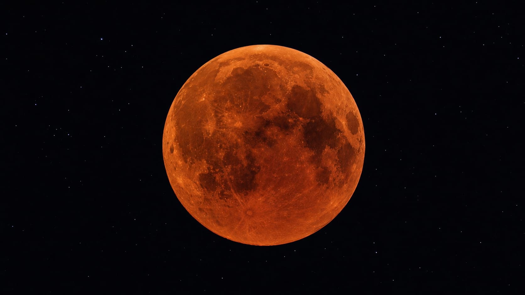 A copper-red moon during a total lunar eclipse.